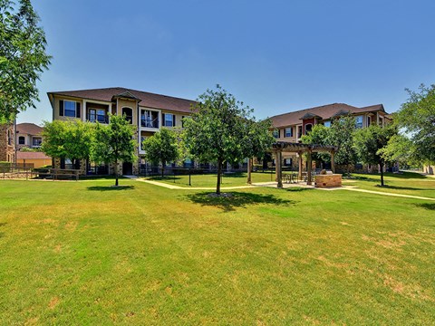 Grass area facing exterior of apartment home structures